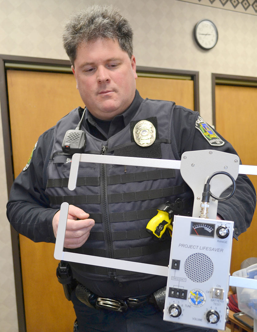 Officer Michael Blocher demonstrates the tracking equipment used for Project Lifesaver.
